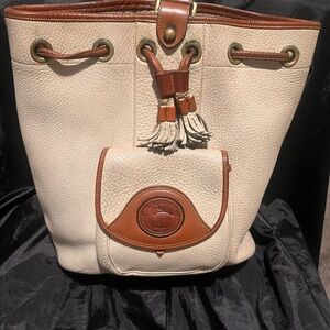 Authentic Dooney and Burk and Coach Purses. All colors and sizes.